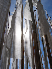 White prayer flags in wind