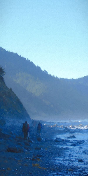 People walking on a rocky beach